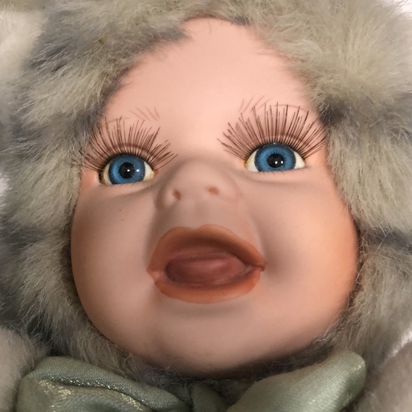 Geppeddo porcelain doll with a cat outfit that is striped and sage bow with bell - Picture 7 of 8